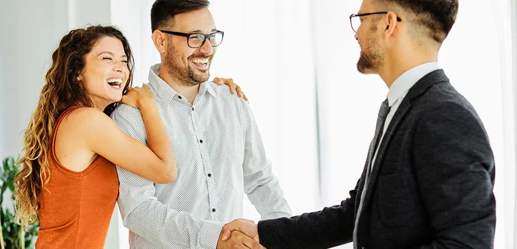 A couple meeting with a real estate professional