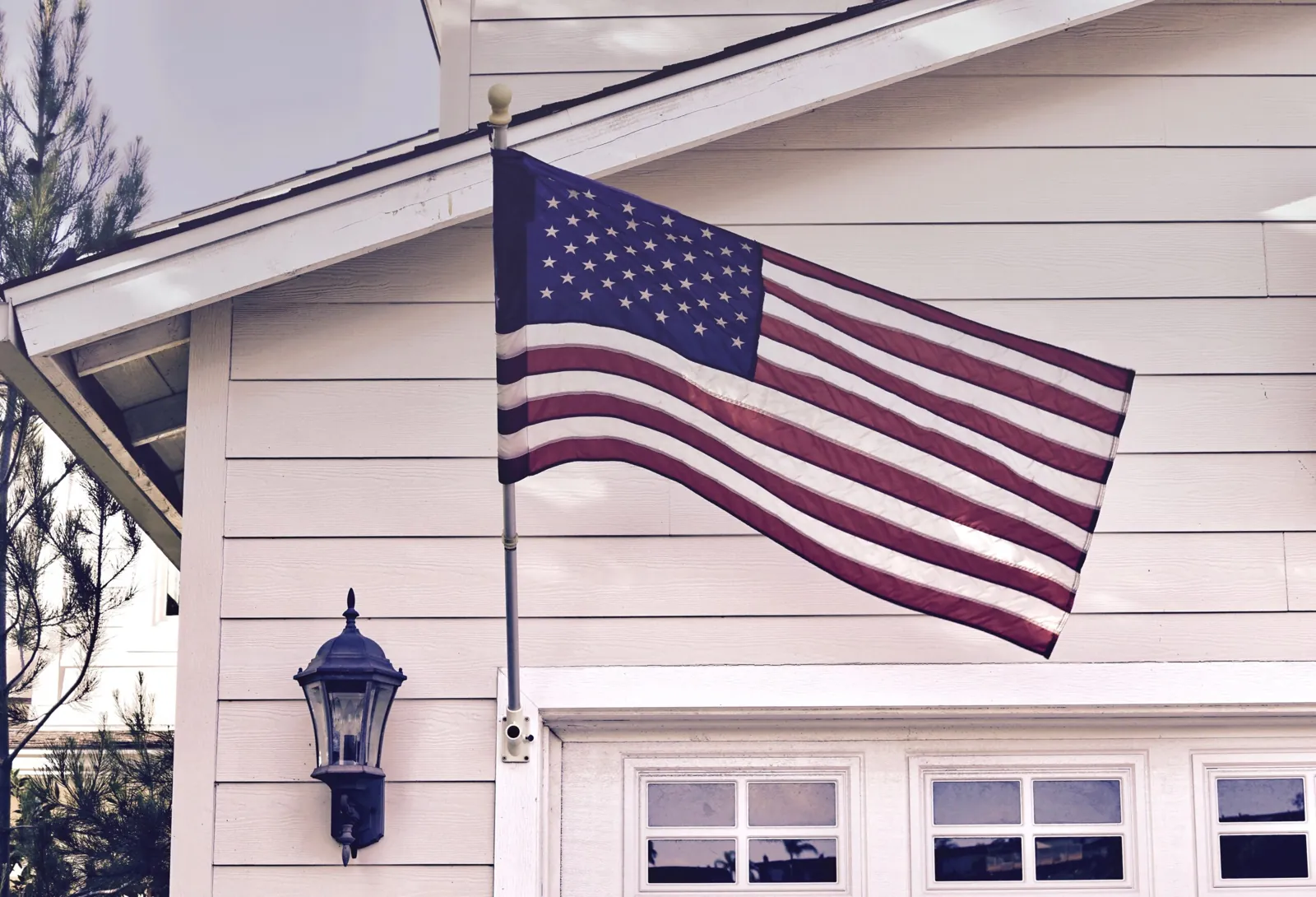 An American flag and architectural details on a home exterior